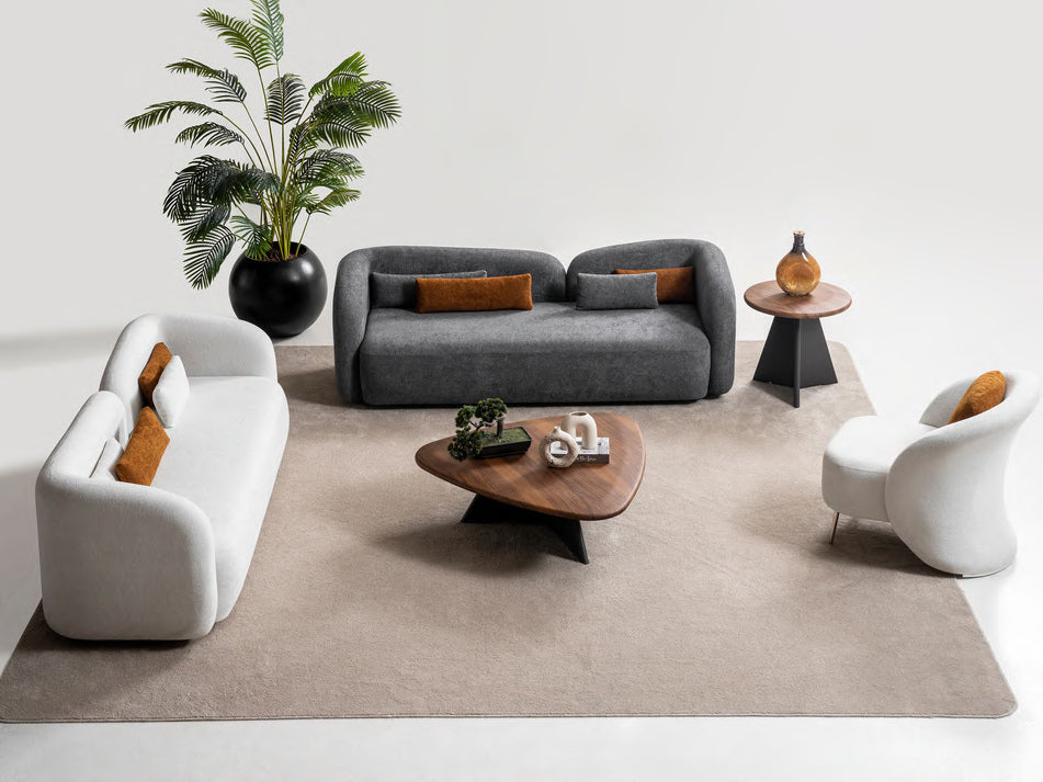 Livia sofa set scene showing two sofas and one armchair; tables and accessories are styling only