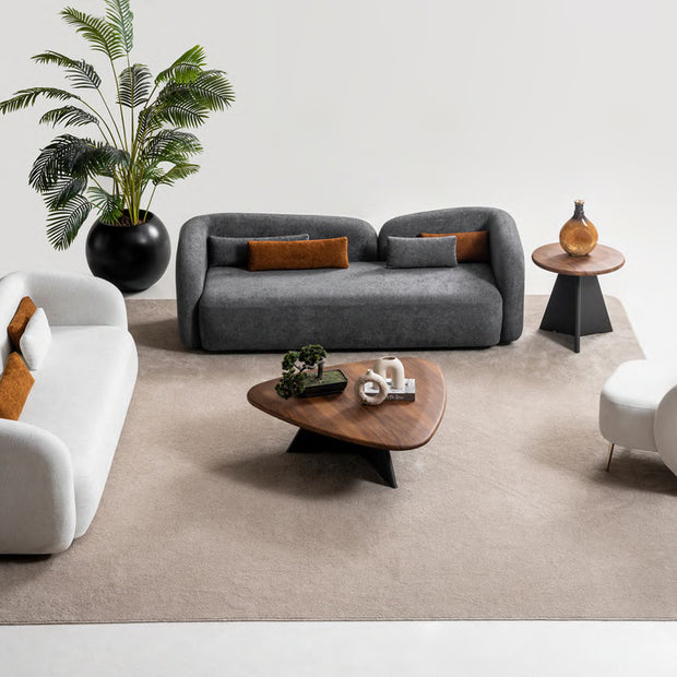 Livia sofa set scene showing two sofas and one armchair; tables and accessories are styling only