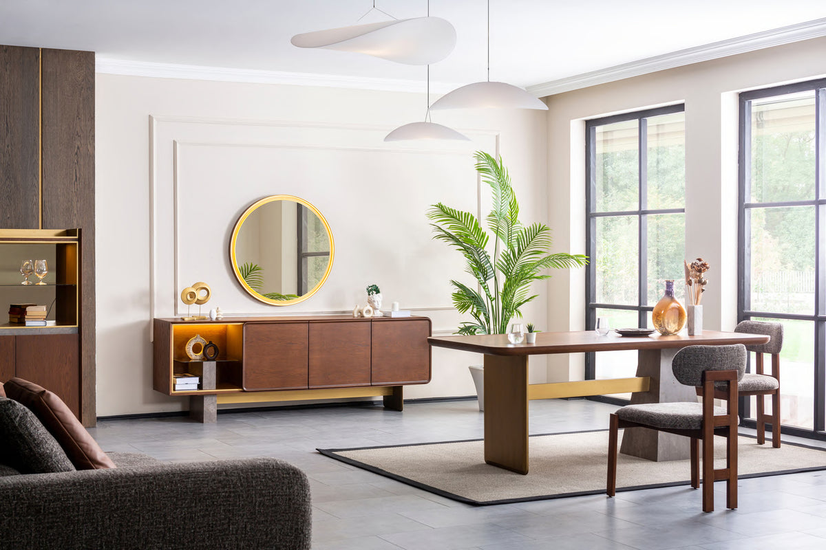Tavira dining table, chairs, sideboard and round mirror in a styled room